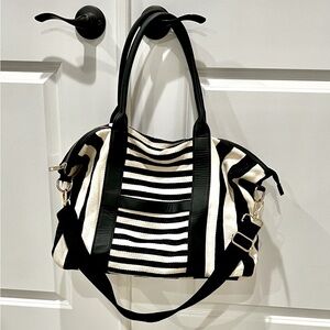 Black and white woven Beach bag. Leather and gold accents. 17x13. Used one time.